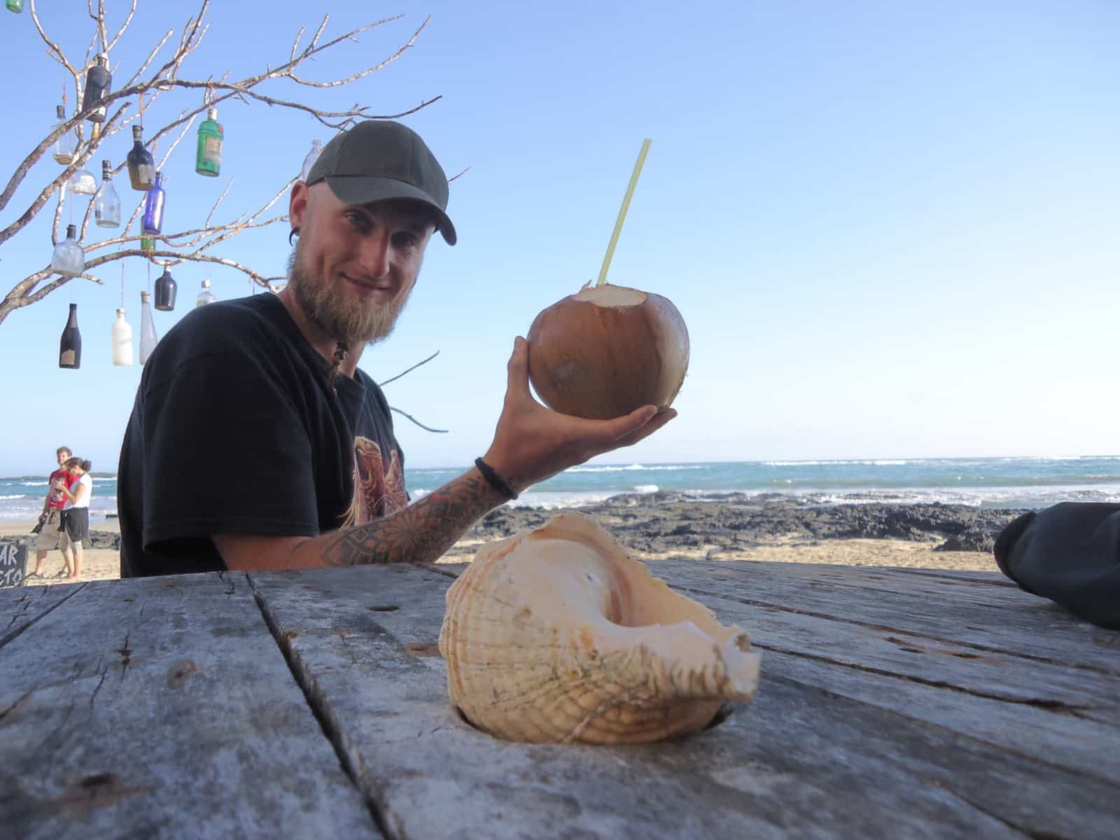 having a coconut drink at Isabela, Galapagos